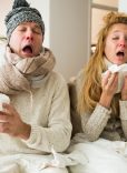 Sick couple catch cold. Man and woman sneezing, coughing, got flu, having runny nose.